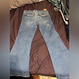 American Eagle Flares with buttons on the back pocket
